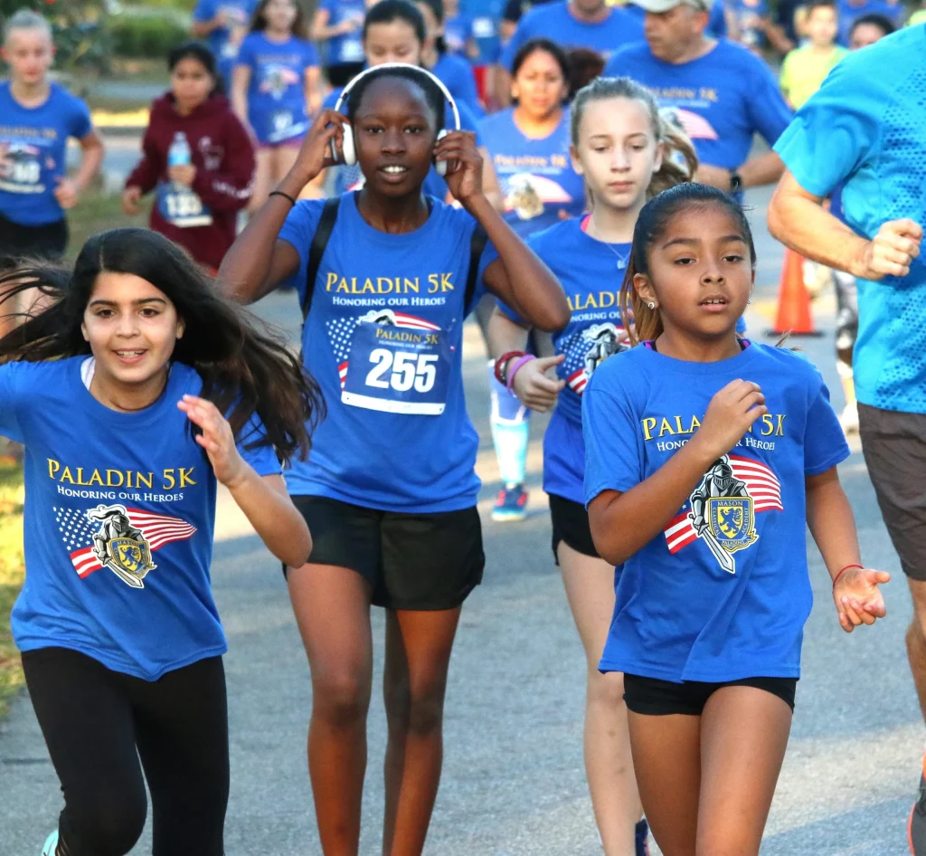 Paladin 5K Race participants wearing short sleeve cotton blend screen print race shirts.