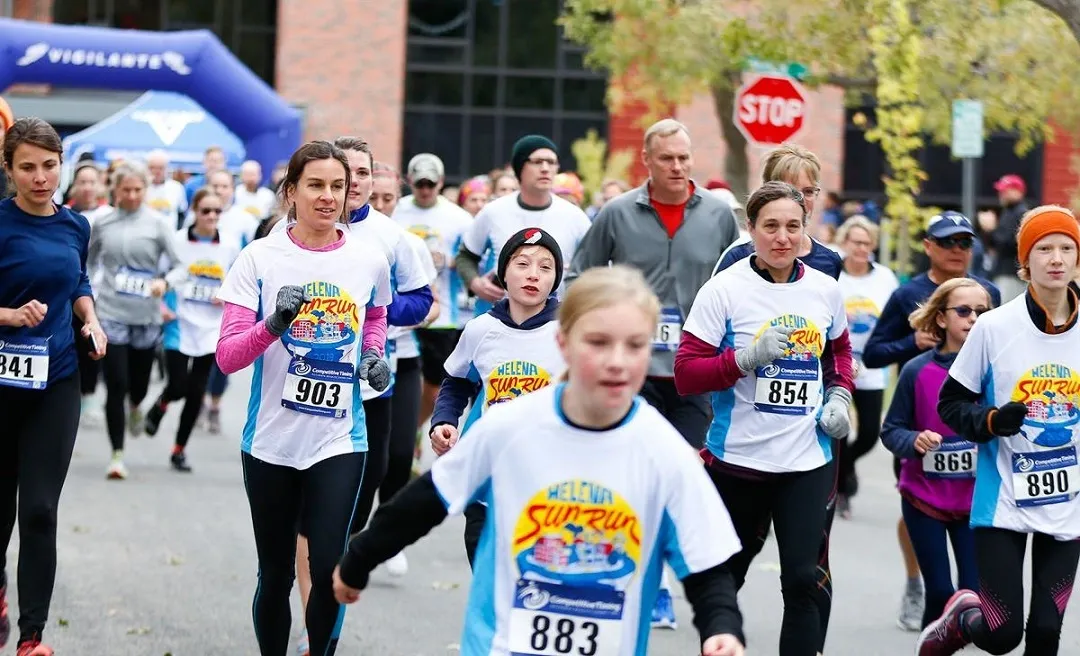 Community fun run with a mix of seasoned runners and youth runners in full color sublimated technical shirts.