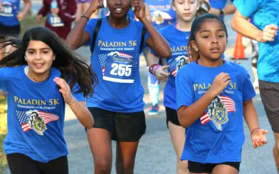 Branded race shirts for all ages at the Paladin 5k running event.