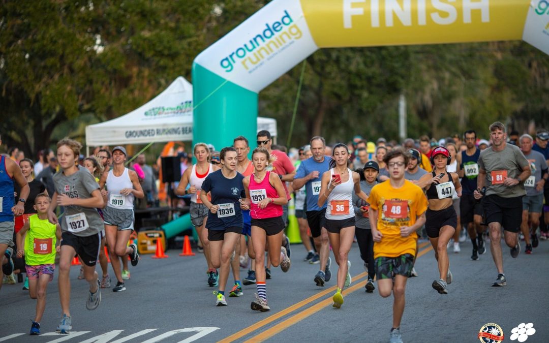 Race Volunteer Handing Out Medals at the Beaufort Triple Crown