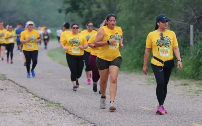 Sole Racing Cinco de Mayo 5k runners in shirts by Running Awards & Apparel.