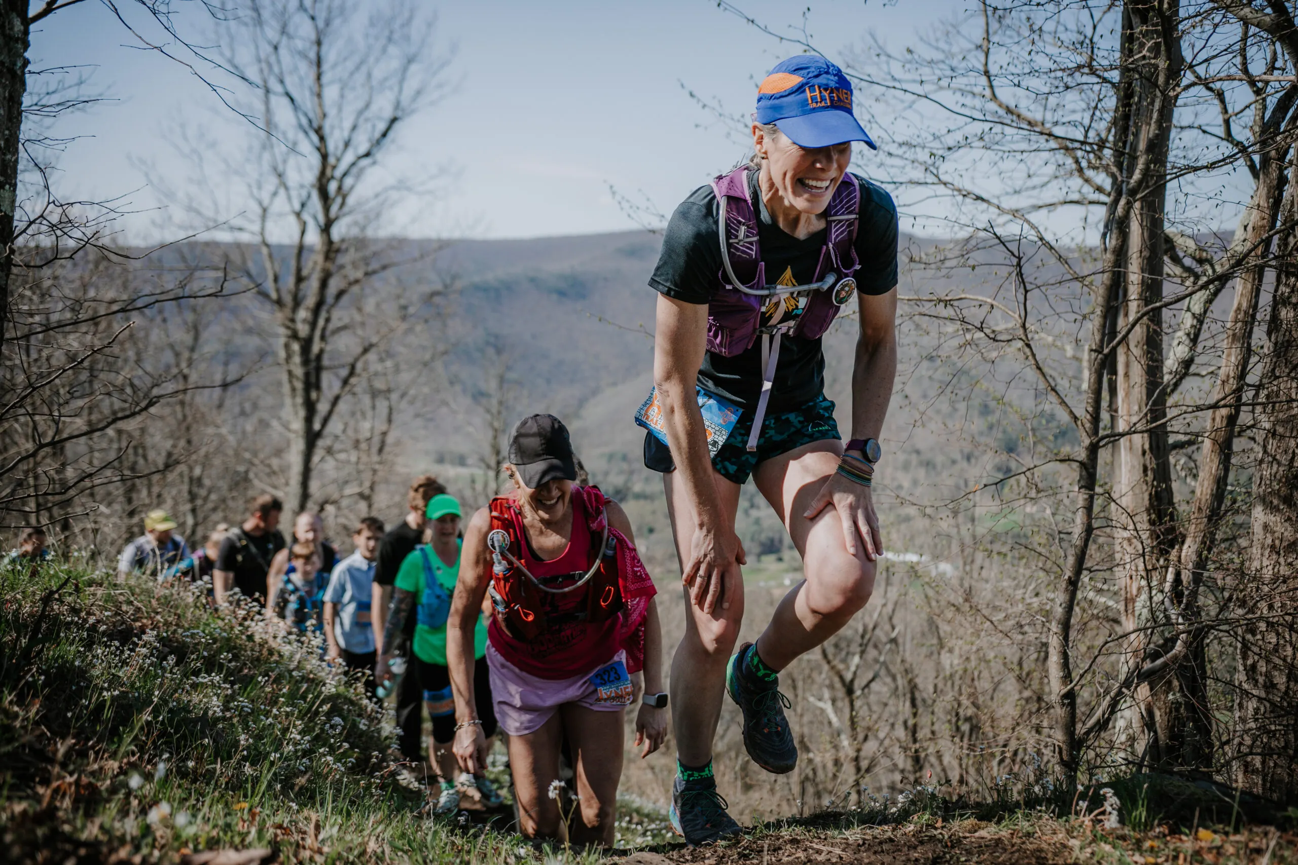 Female trail runner in Racetrackers 6500A Run-Dri Hat.