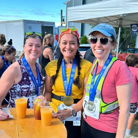 Happy Finishers at the Finish Line Expo Wearing Their Mt. Baldhead Race Medals