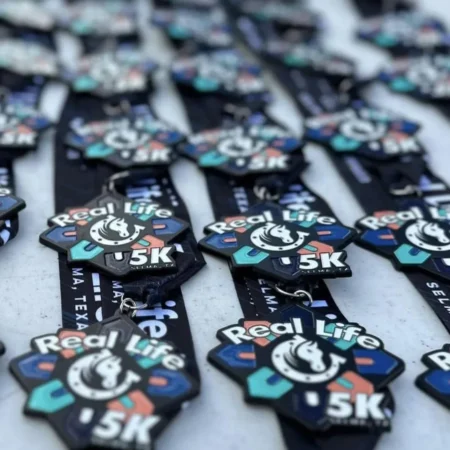 Custom Black Dye Medals with Feed Through Ribbon for the Real Life 5K