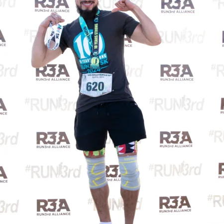 Happy Finisher With His Medal at the Run 3rd Alliance 5K